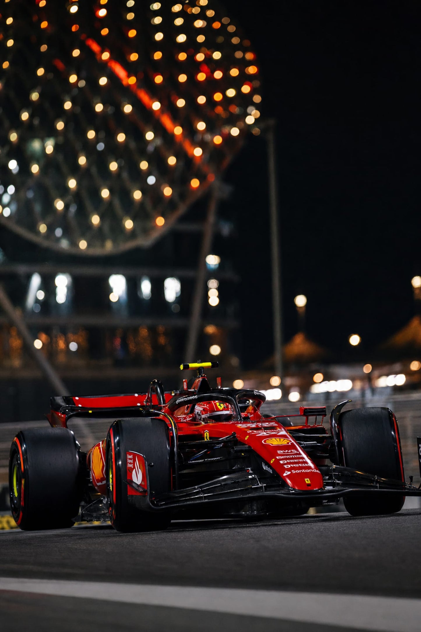FERRARI: RED RACE CAR AT NIGHT