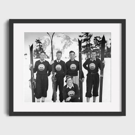 Group of Skiers Posing with Skis | Team Spirit on the Slopes: Vintage Group Ski Photo | Collectible Ski Posters