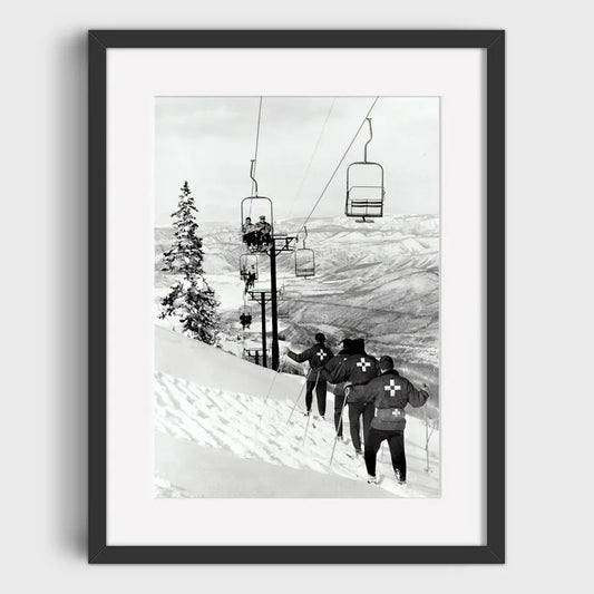 Ski Patrol Assisting on a Snowy Slope with Chairlift | High-Altitude Rescue: Ski Patrol in Action | Vintage Ski Posters Collection